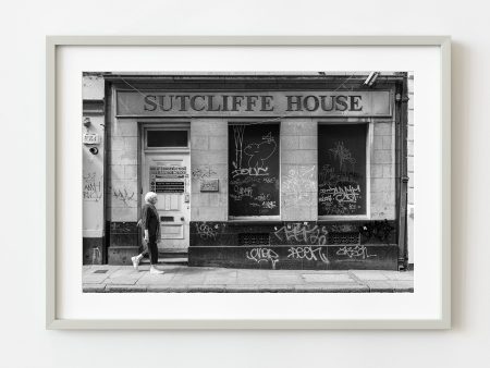 Woman walks by Sutcliffe House Dublin Ireland | Wall Art Online now